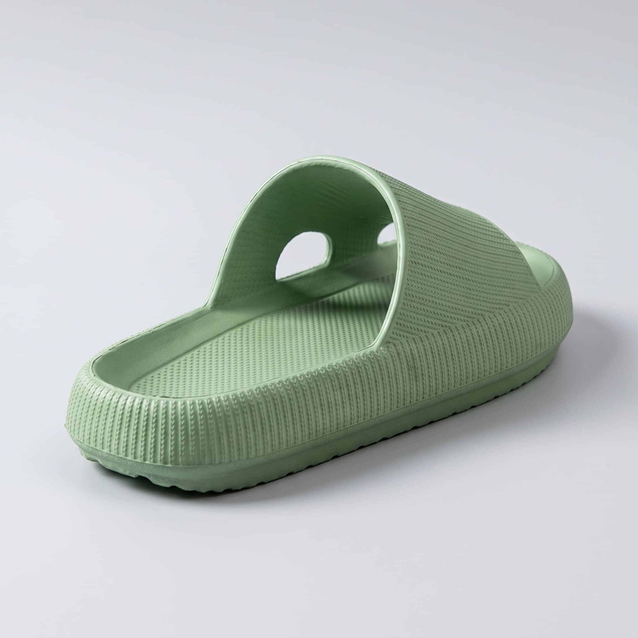 FORCIANO DUNE green height increasing shoes shown from a rear three-quarter angle with the textured footbed, strap, and cushioned sole visible.
