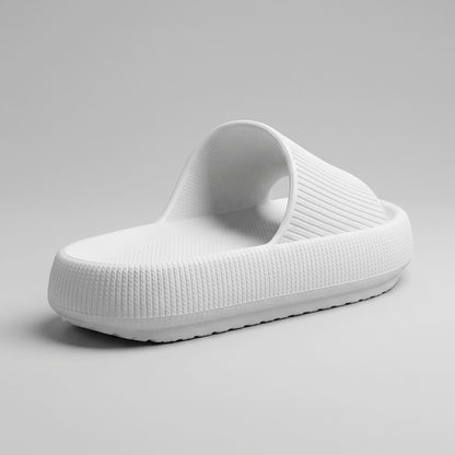 FORCIANO DUNE white height increasing shoes viewed from the rear three-quarter angle with textured surfaces and a cushioned sole.