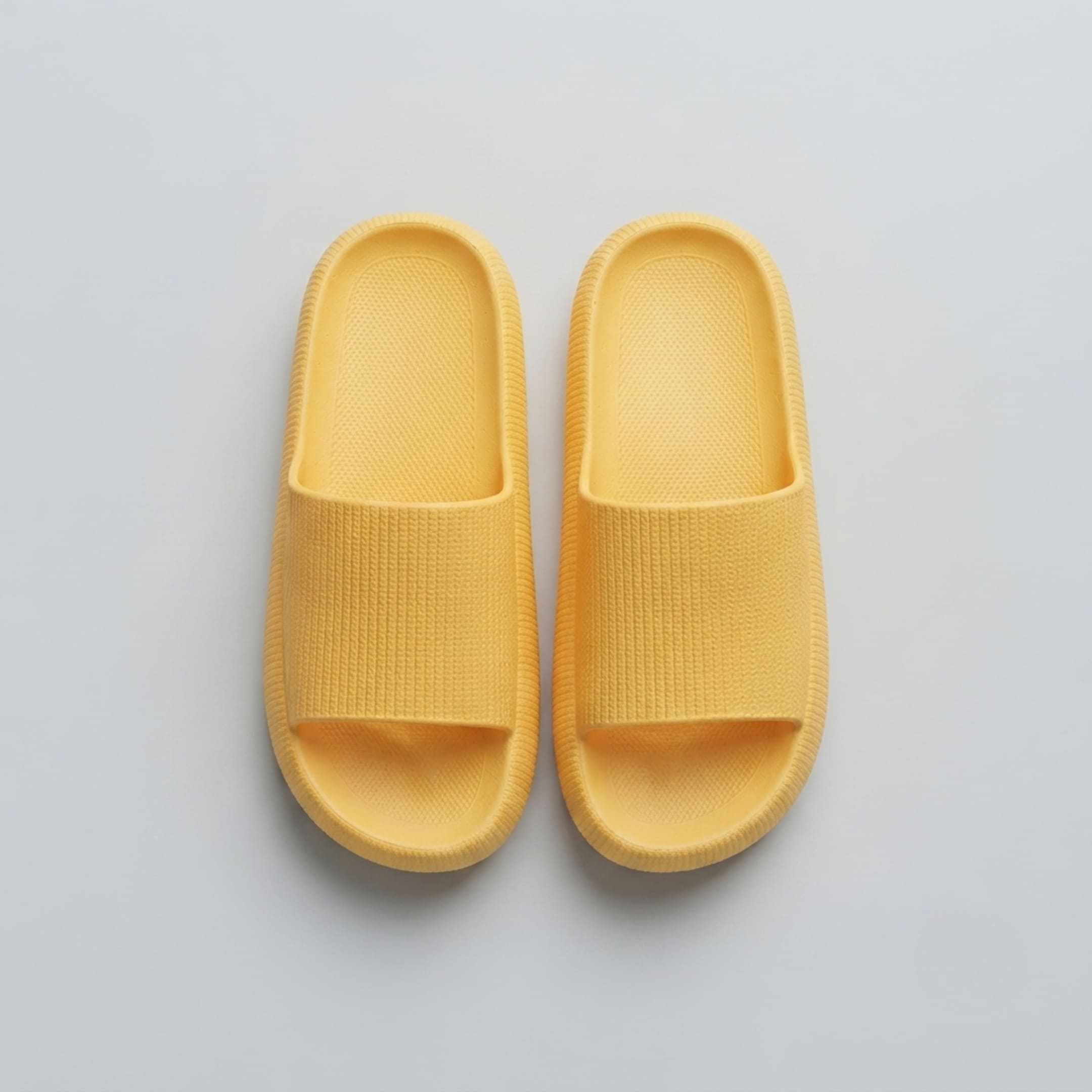 FORCIANO DUNE yellow height increasing shoes displayed as a pair in a top view with matching textured straps and footbeds.