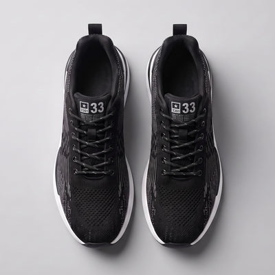 FORCIANO EDGE black Height Increasing Sneakers shown as a pair from the top with lace-up design, white soles and breathable material.