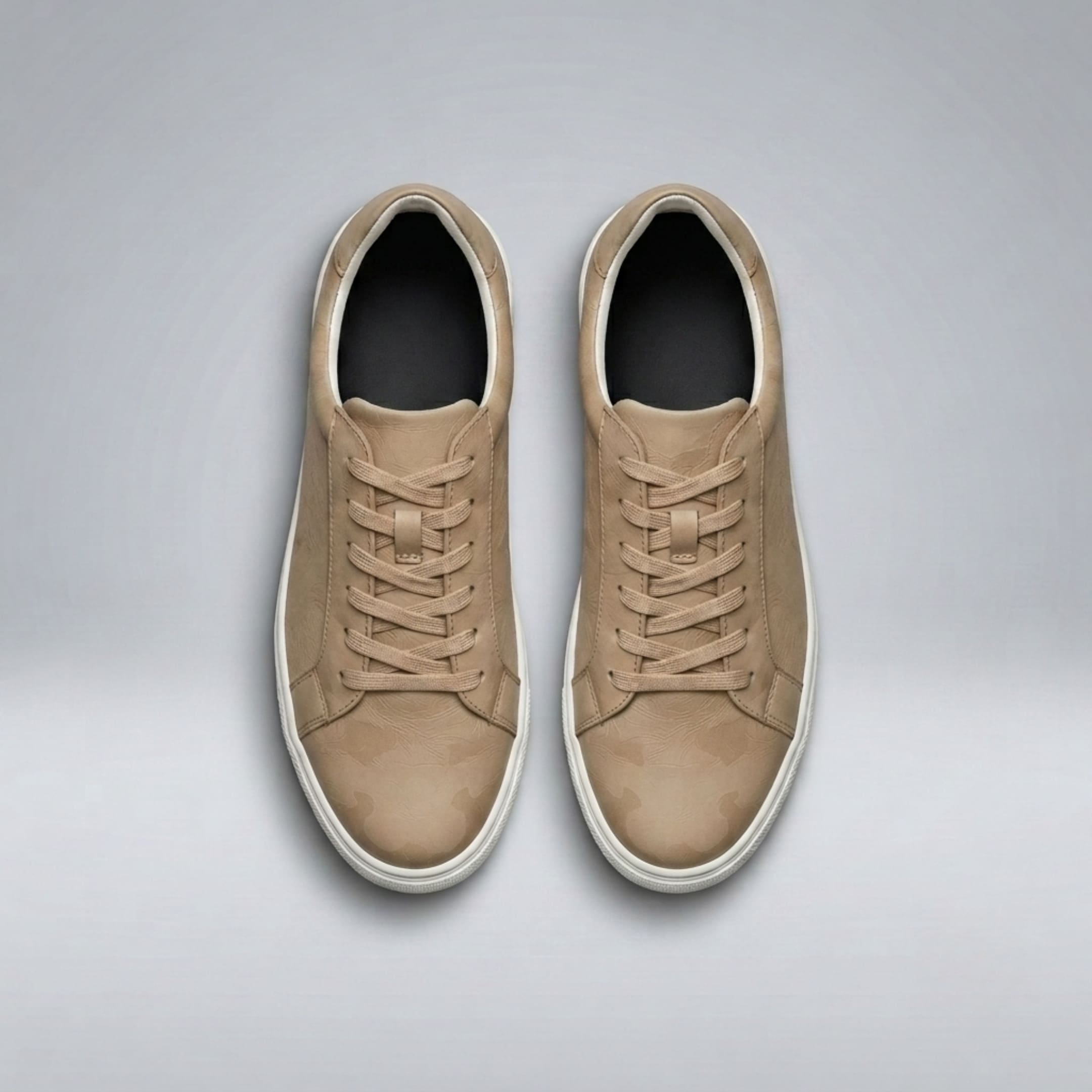 Top view of a pair of FORCIANO ELEMENT beige Height Increasing Sneakers with premium leather uppers, matching laces, white soles, and dark insoles.