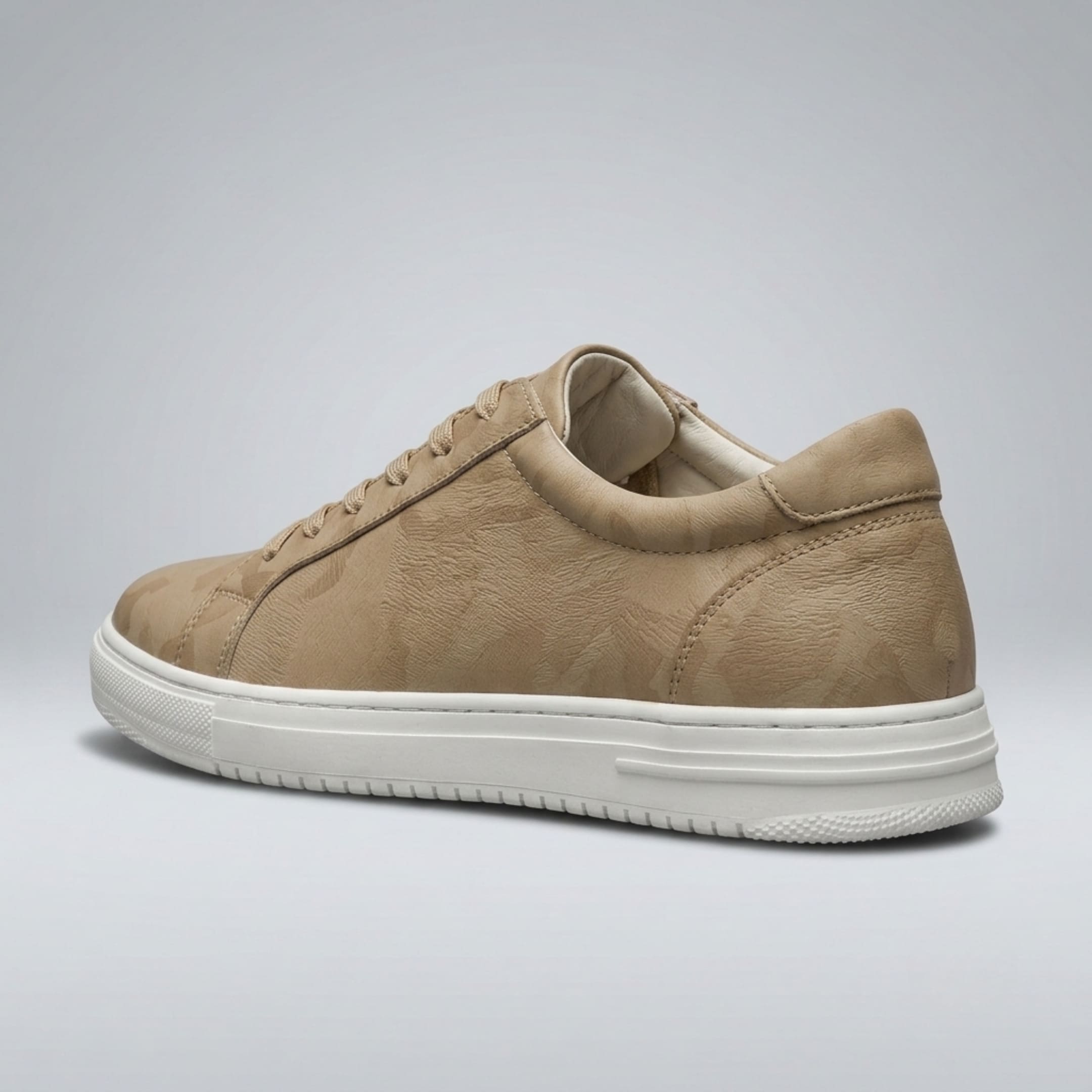 Rear three-quarter view of the FORCIANO ELEMENT beige premium leather Height increasing sneaker showing the padded collar, heel panel, side upper, and white sole.