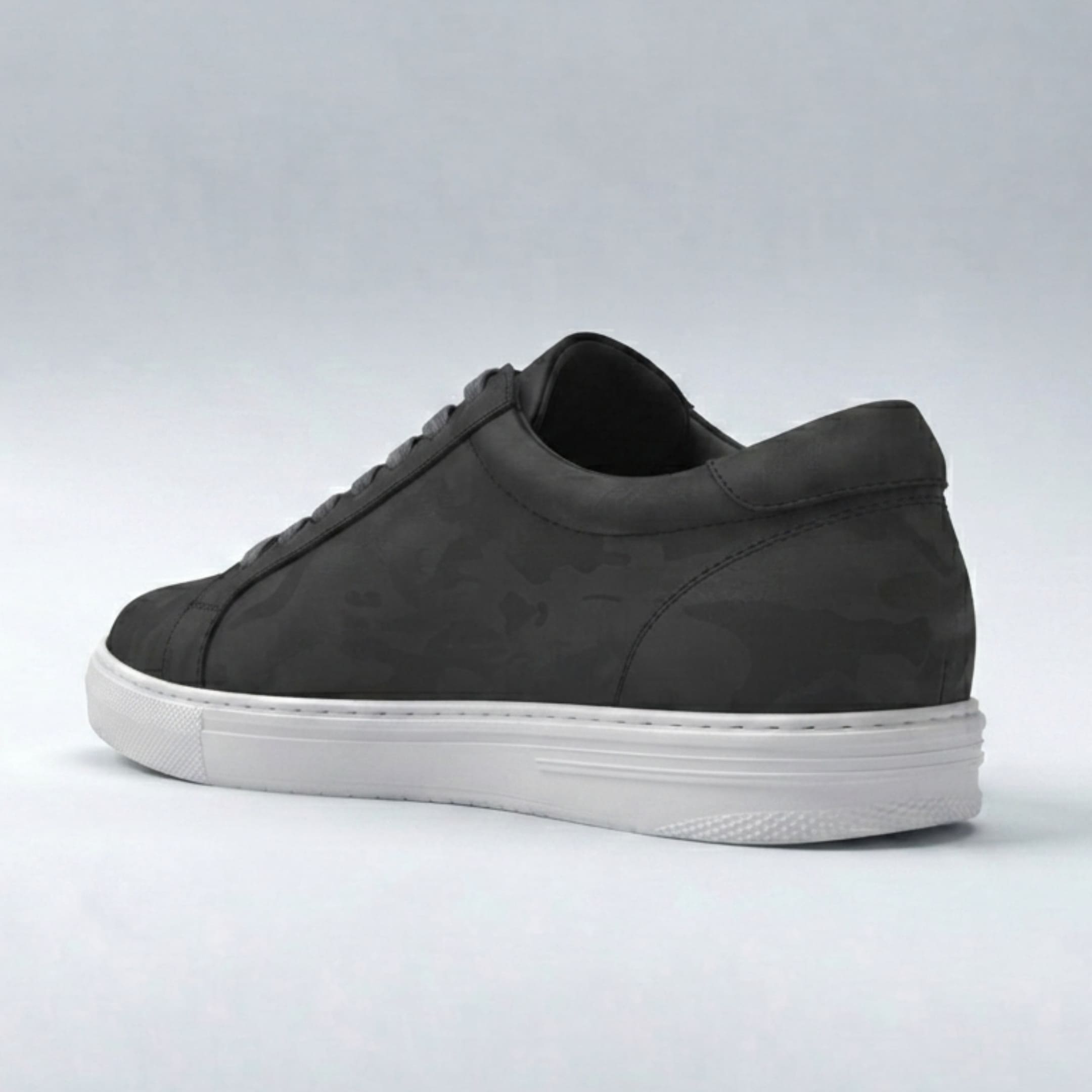FORCIANO ELEMENT black Height Increasing Sneaker shown from a rear three-quarter angle with premium leather upper, heel panel, and white sole.