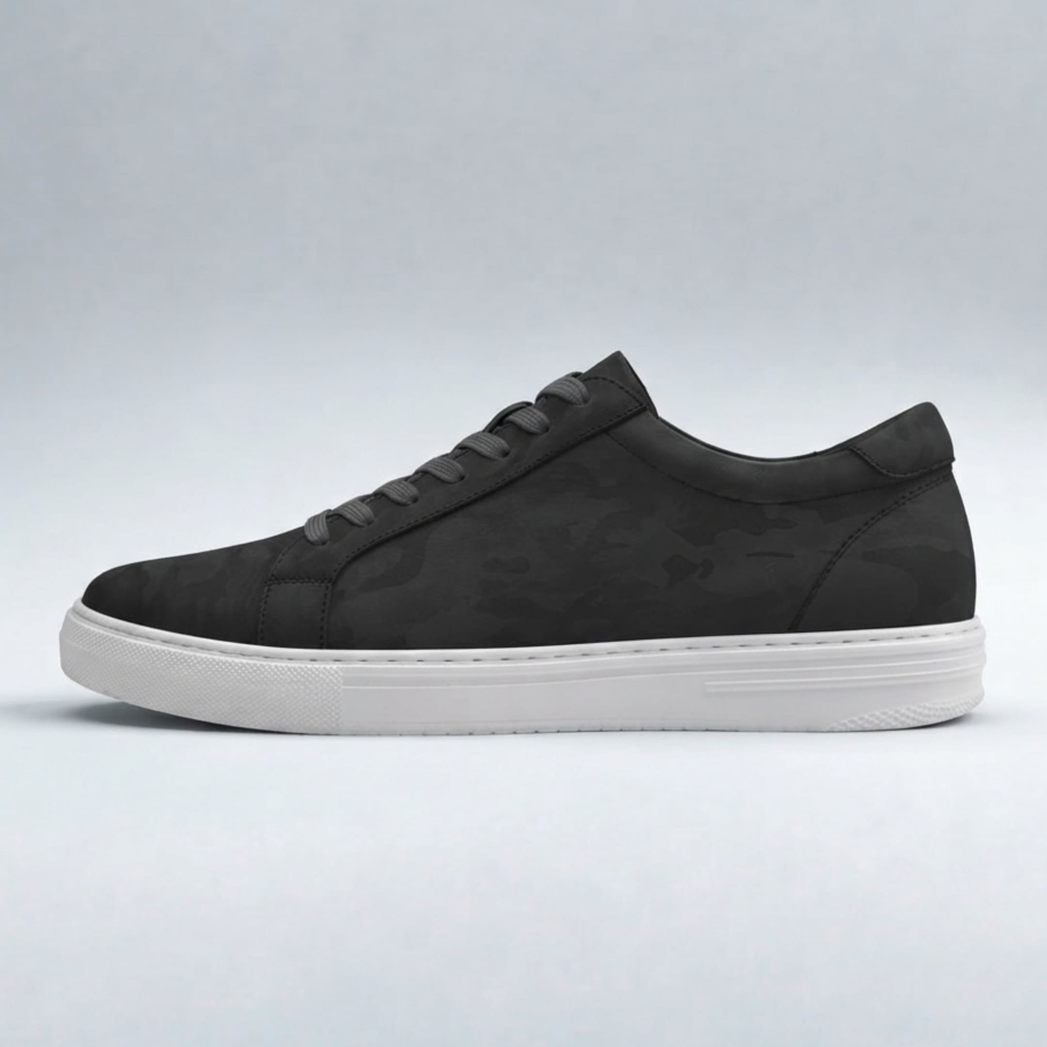 Side profile of the FORCIANO ELEMENT black Height Increasing Sneaker featuring a premium leather upper with subtle tonal patterning and white sole.