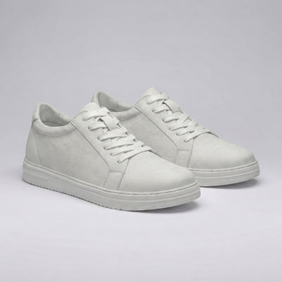 Pair of FORCIANO ELEMENT white Height Increasing Sneakers shown from a front angled view with premium leather uppers, white laces, and white soles.