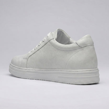 Rear three-quarter view of the FORCIANO ELEMENT white premium leather Height increasing sneaker showing its stitched heel panel, tonal upper, and white sole.