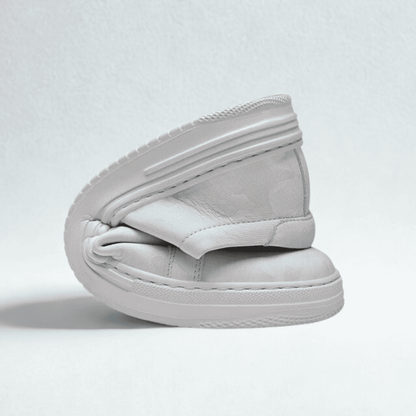 FORCIANO ELEMENT white premium leather Hieight increasing sneaker shown folded, revealing the upper, sole, stitching, and layered shoe construction.