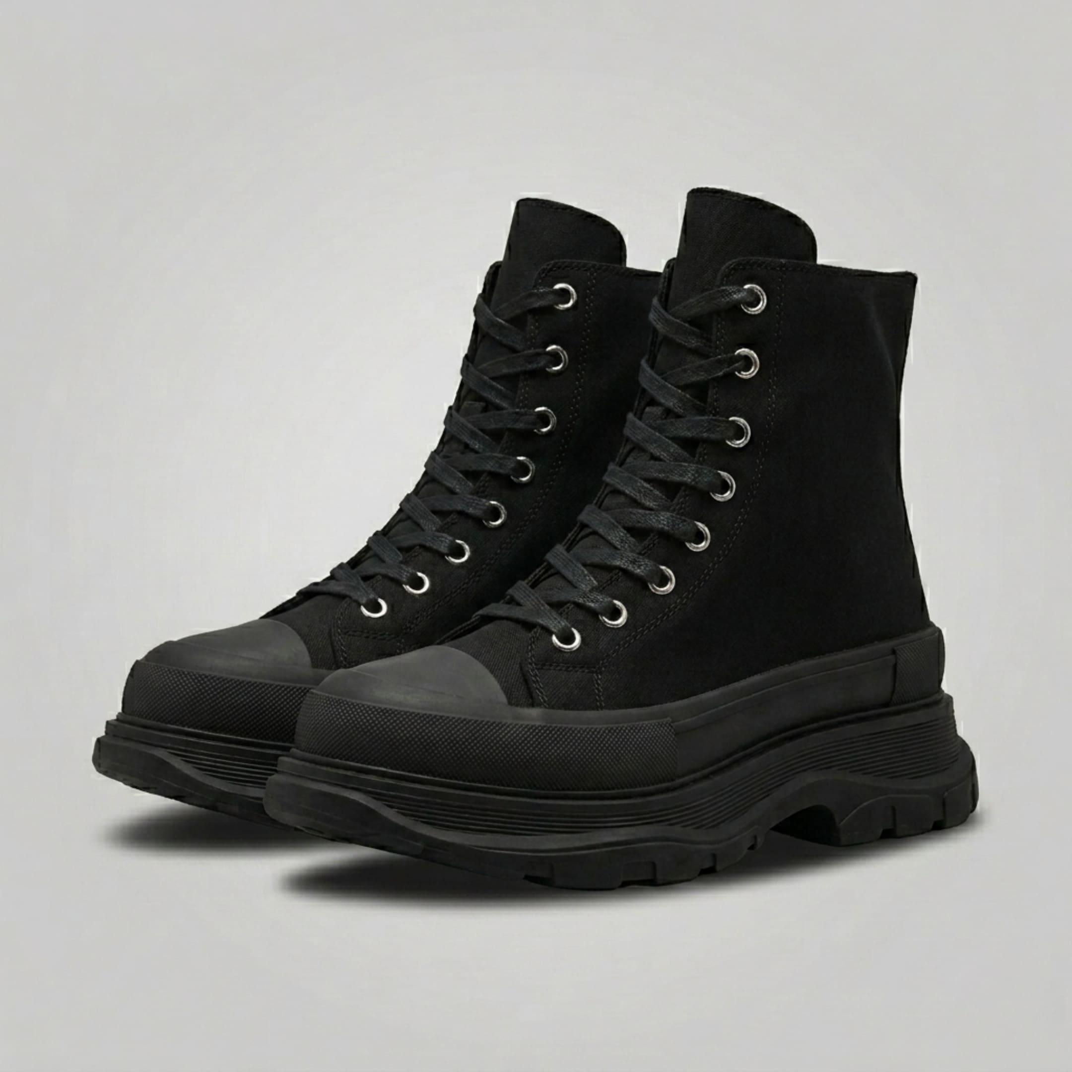FORCIANO ELEVATOR black height increasing sneakers with thick cushioned high-top construction shown as a pair from a front three-quarter angle.