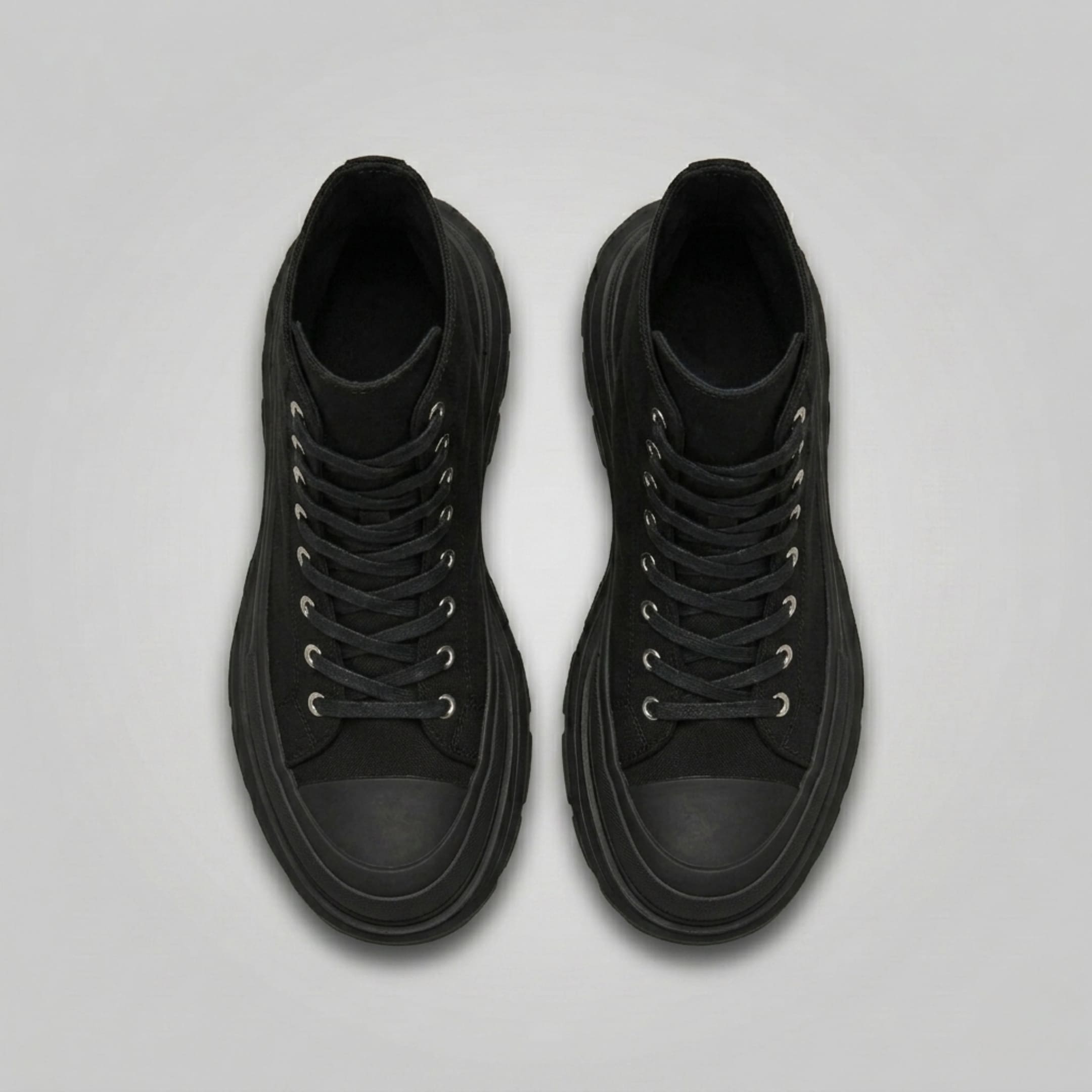 FORCIANO ELEVATOR black height increasing sneakers shown as a pair from the top with black laces and thick cushioned soles.