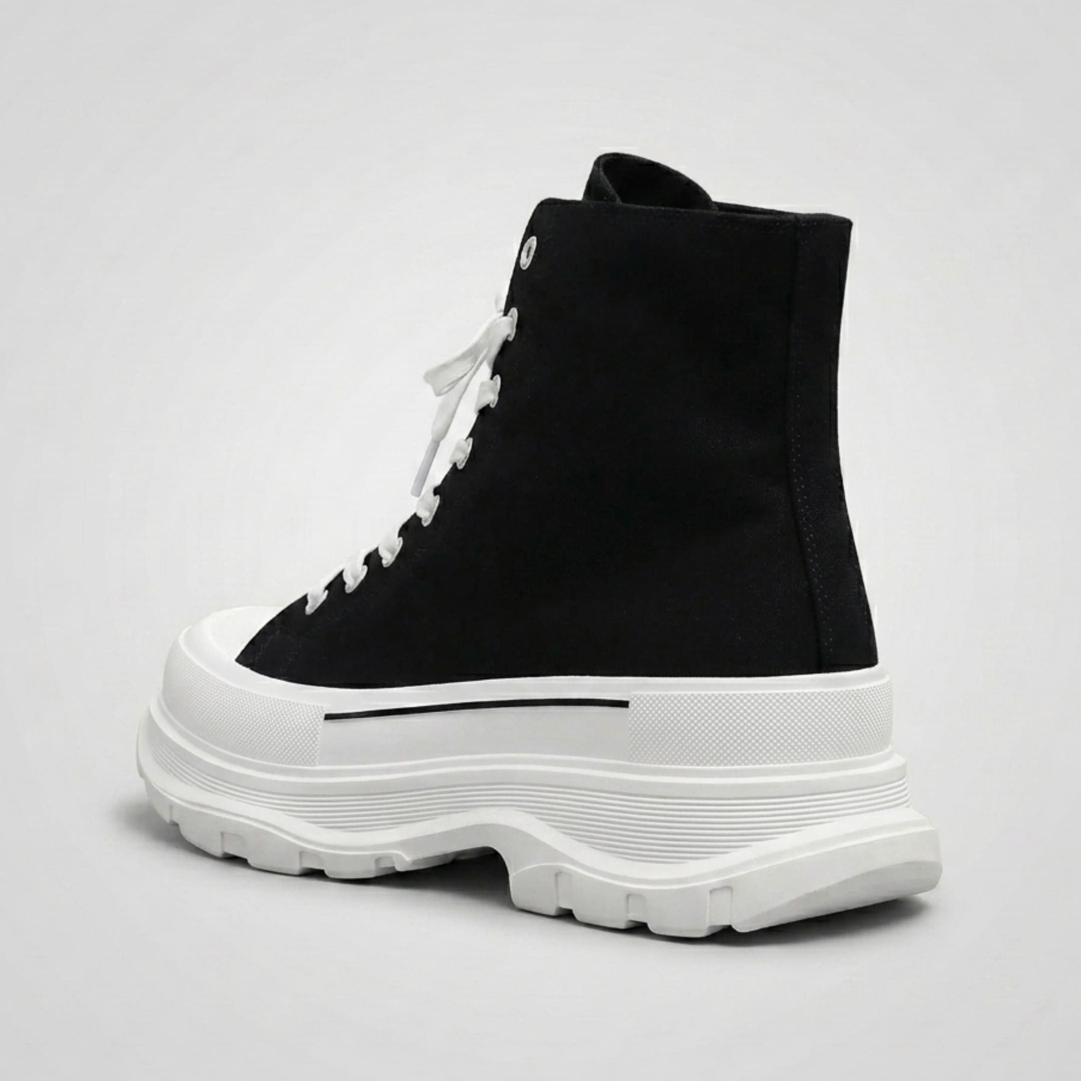 FORCIANO ELEVATOR black and white height increasing sneaker with thick cushioned sole shown from a rear three-quarter angle.