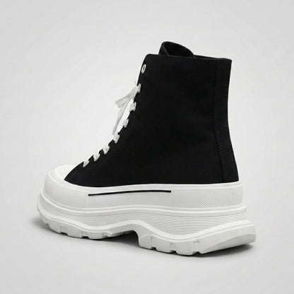 FORCIANO ELEVATOR black and white height increasing sneaker with thick cushioned sole shown from a rear three-quarter angle.