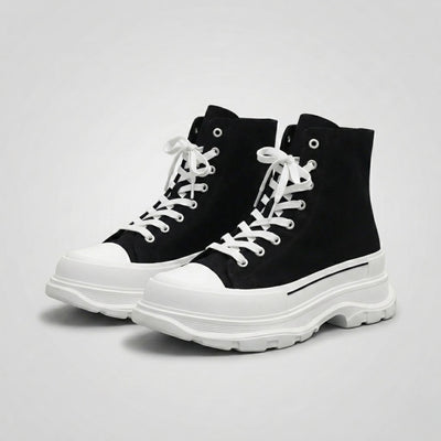 FORCIANO ELEVATOR black and white height increasing sneakers with thick cushioned high-top construction shown as a pair from a front three-quarter angle.