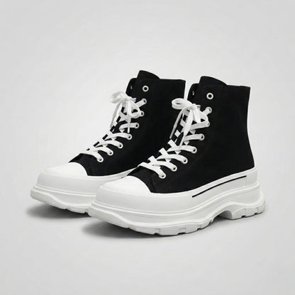 FORCIANO ELEVATOR black and white height increasing sneakers with thick cushioned high-top construction shown as a pair from a front three-quarter angle.