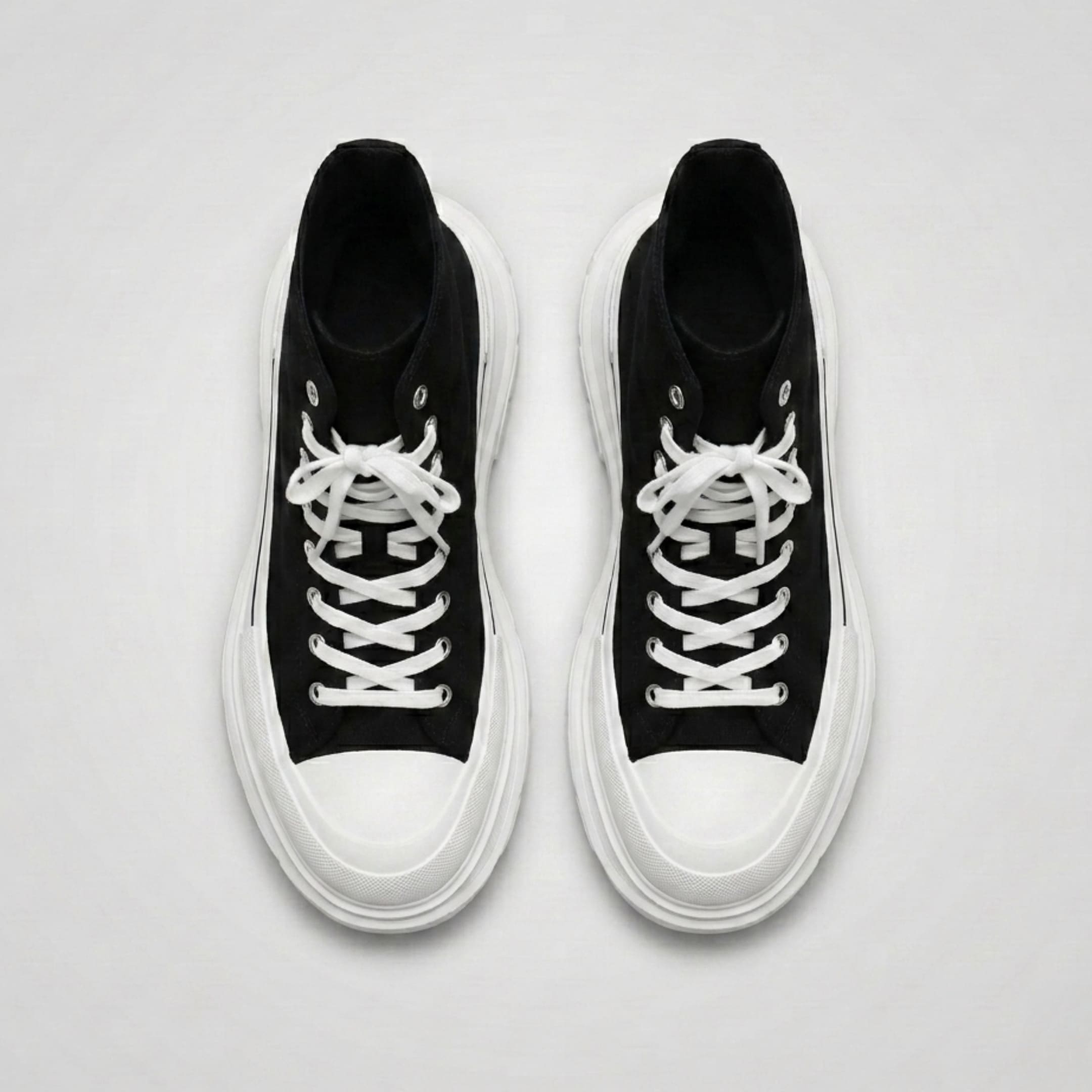 FORCIANO ELEVATOR black and white height increasing sneakers shown as a pair from the top with white laces and thick cushioned soles.