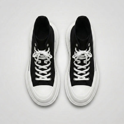 FORCIANO ELEVATOR black and white height increasing sneakers shown as a pair from the top with white laces and thick cushioned soles.