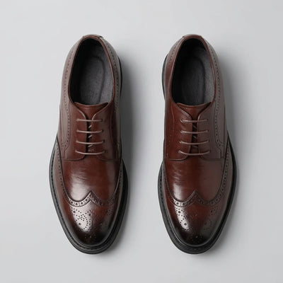 Top view of FORCIANO FAIRMONT brown height increasing dress shoes showing the pair, lace-up fronts and decorative brogue pattern.