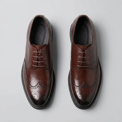 Top view of FORCIANO FAIRMONT brown height increasing dress shoes showing the pair, lace-up fronts and decorative brogue pattern.