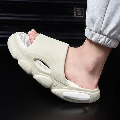 FORCIANO FEROX Beige-White ultra-soft EVA height increasing slippers shown on foot in a close side view.