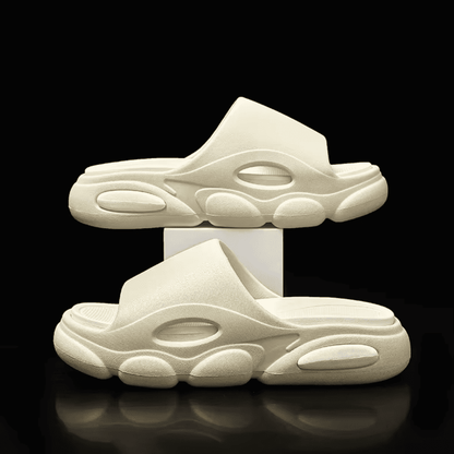 FORCIANO FEROX Beige-White height increasing slippers displayed as a pair in side-profile and three-quarter views against a black background.