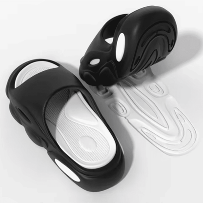 FORCIANO FEROX Black-White height increasing slippers shown as a pair with the white cushioned footbed and patterned outsole visible.