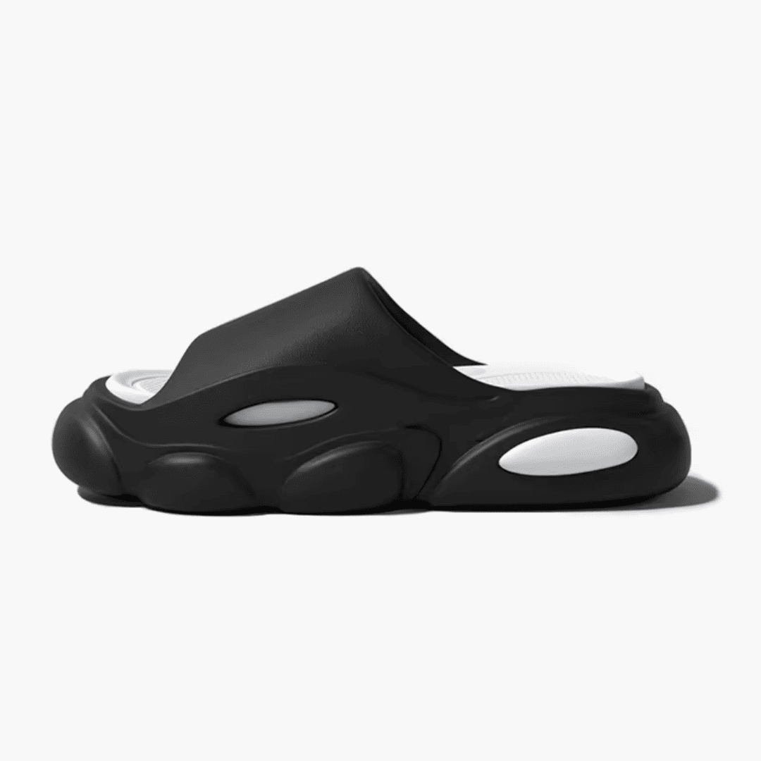FORCIANO FEROX Black-White height increasing slippers in a clean side profile, showing the ultra-soft EVA construction.