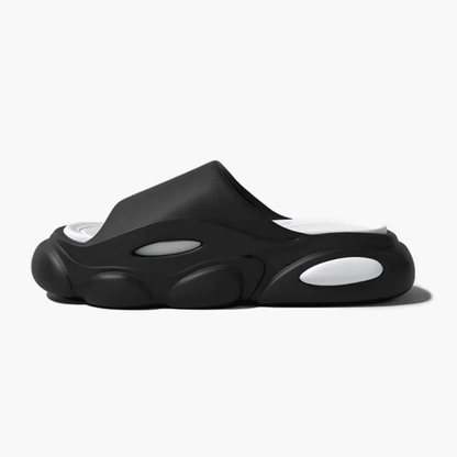 FORCIANO FEROX Black-White height increasing slippers in a clean side profile, showing the ultra-soft EVA construction.
