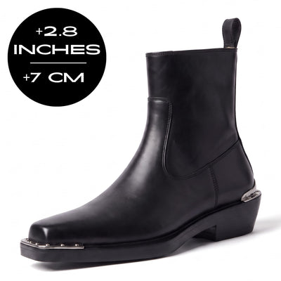 FORCIANO FERRANTE Elevator Boots in Black, featuring a smooth finish, ankle-high silhouette, rear pull tab, metal toe detailing and black low-block heel with a 2.8" / 7 cm height increase.