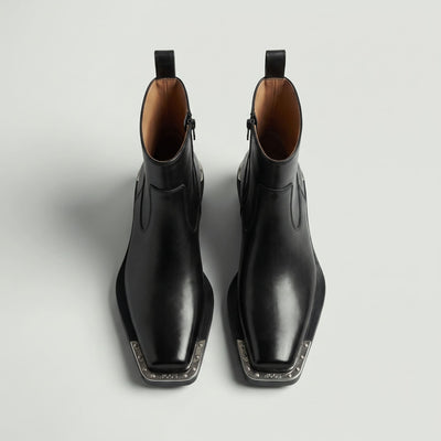 FORCIANO FERRANTE Elevator Boots in black, shown as a pair from a top-front view with smooth microfiber uppers, square toes, and metallic toe trim.