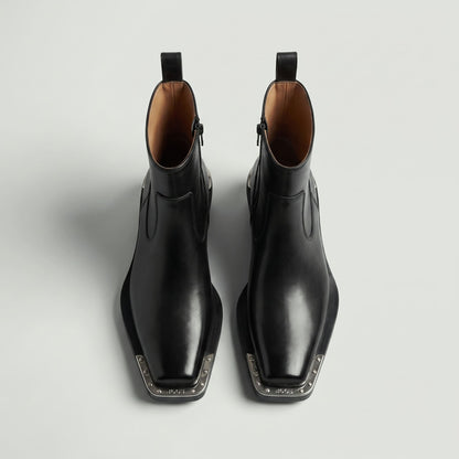 FORCIANO FERRANTE Elevator Boots in black, shown as a pair from a top-front view with smooth microfiber uppers, square toes, and metallic toe trim.