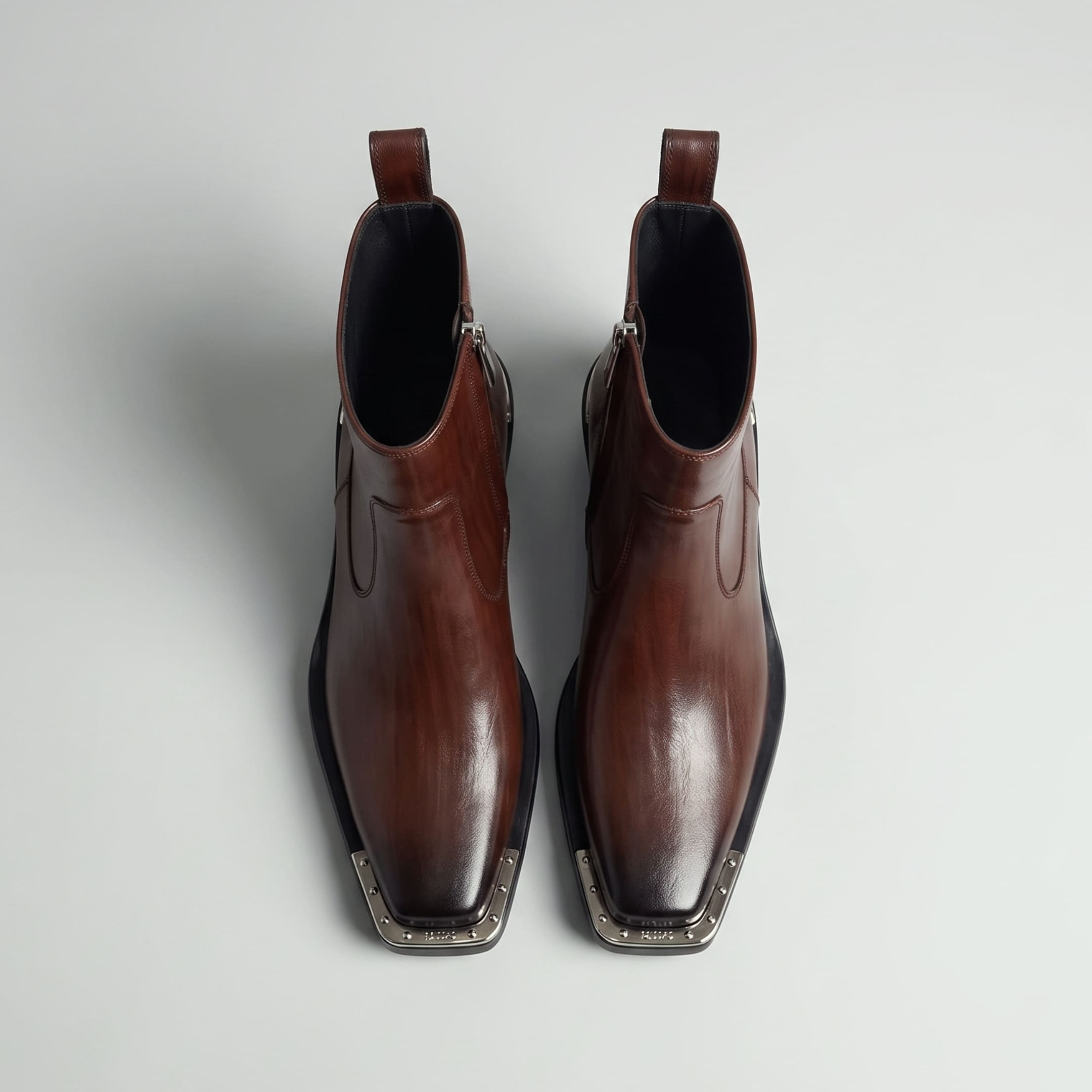 FORCIANO FERRANTE Elevator Boots in dark brown, shown as a pair from a top-front view with smooth microfiber uppers, square toes, and metallic toe detailing.
