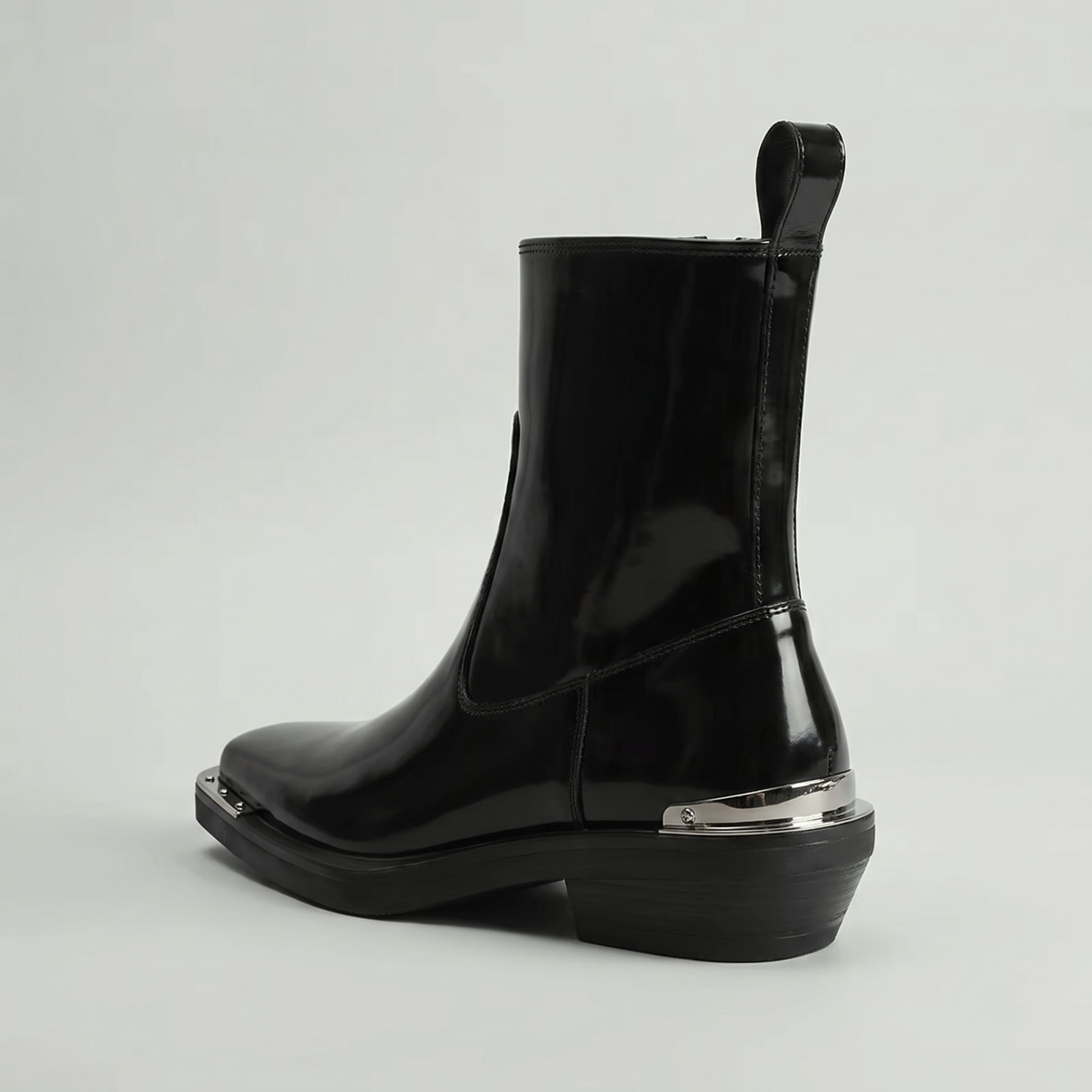 FORCIANO FERRANTE Elevator Boots in glossy black, displayed from a rear three-quarter angle with a smooth microfiber upper, pull tab, heel profile, and metallic trim.