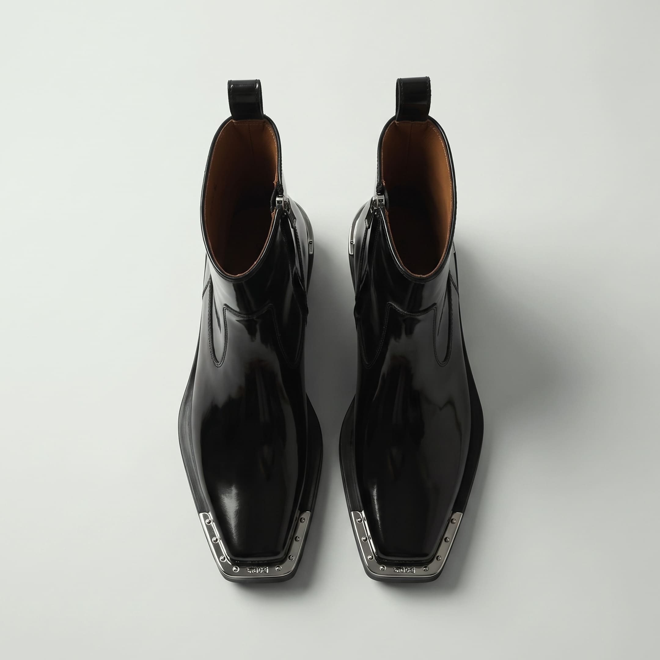 FORCIANO FERRANTE Elevator Boots in glossy black, shown as a pair from a top-front view with smooth microfiber uppers, square toes, and metallic toe trim.