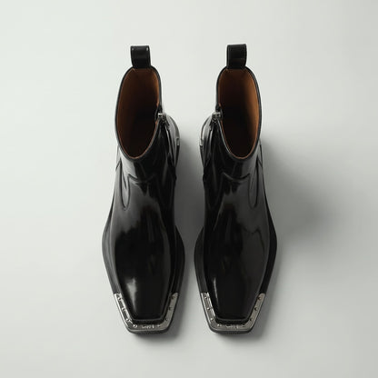 FORCIANO FERRANTE Elevator Boots in glossy black, shown as a pair from a top-front view with smooth microfiber uppers, square toes, and metallic toe trim.