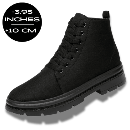 FORCIANO FORTITUDE black elevator boots shown from a front three-quarter angle with a 10 cm / 3.95" height increase graphic.
