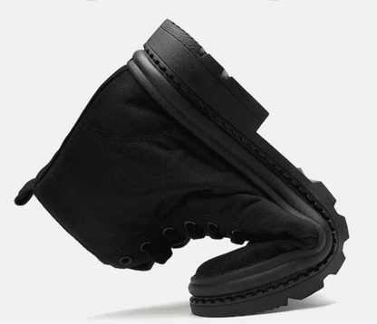 FORCIANO FORTITUDE black elevator boot shown bent to demonstrate the visible flexibility of the upper and sole.