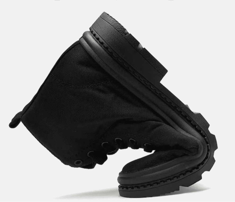 FORCIANO FORTITUDE black elevator boot shown bent to demonstrate the visible flexibility of the upper and sole.