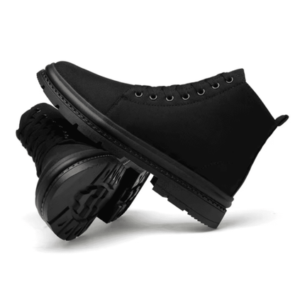 Pair of FORCIANO FORTITUDE black elevator boots arranged in side views, showing the lace-up design and black lug soles.
