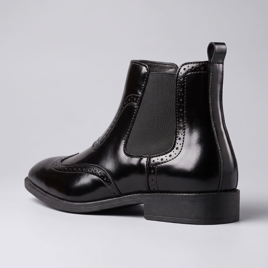 FORCIANO FORTRESS black Elevator Boots shown from the rear side angle with elastic panel, pull tab and low heel.