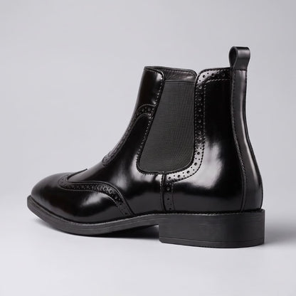 FORCIANO FORTRESS black Elevator Boots shown from the rear side angle with elastic panel, pull tab and low heel.