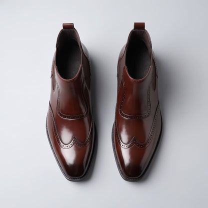 Top view of a dark brown pair of FORCIANO FORTRESS Elevator Boots showing leather uppers and wingtip detailing