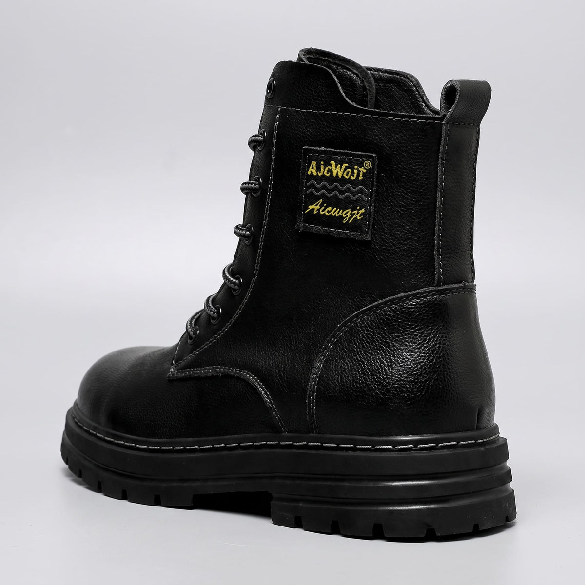FORCIANO FRONTLINE Boots That Make You Taller in black premium leather shown from the rear three-quarter angle with heel, pull tab and side profile visible.