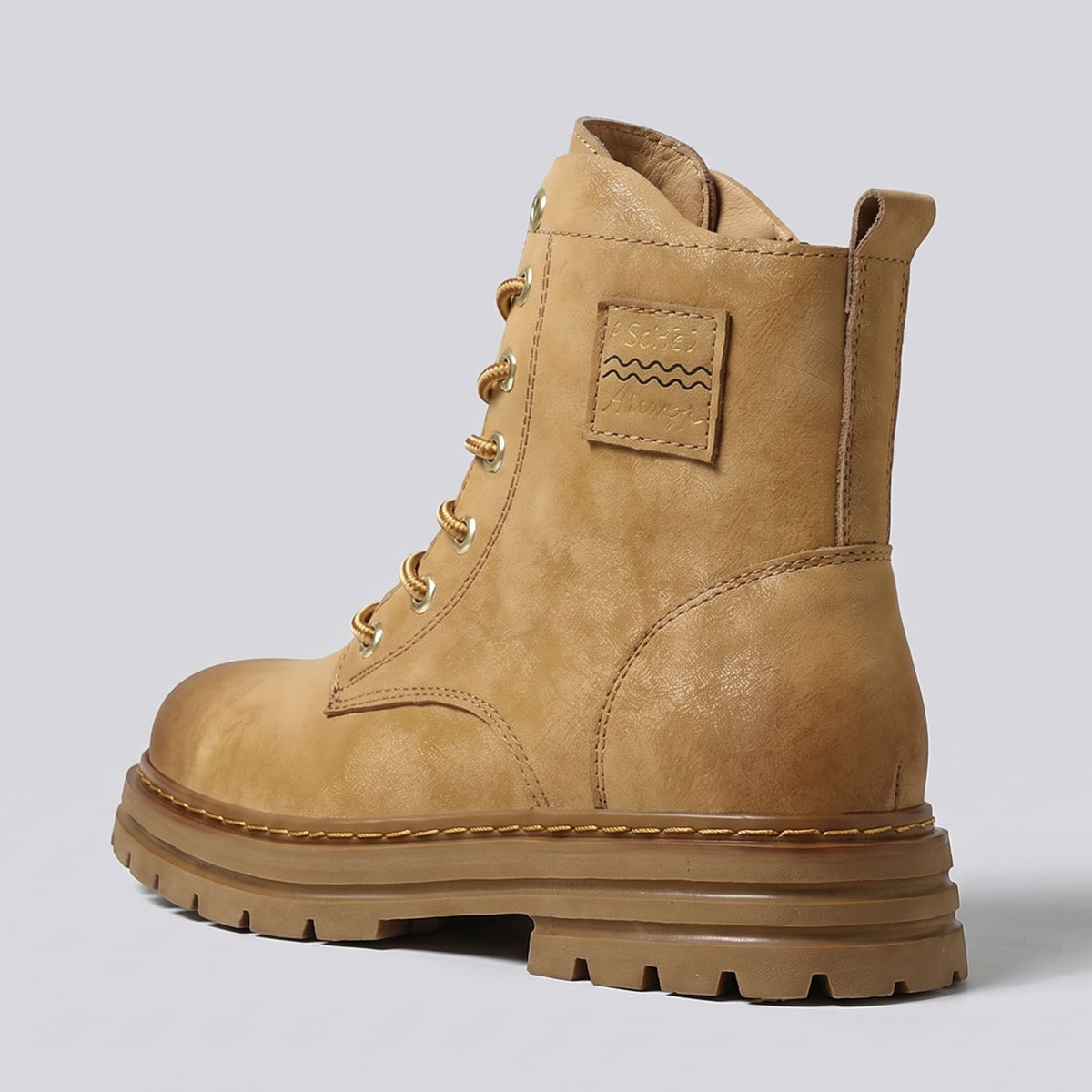 FORCIANO FRONTLINE Boots That Make You Taller in brown premium leather shown from the rear three-quarter angle with heel and side stitching visible.