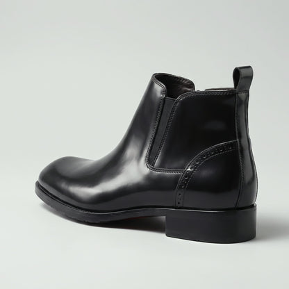 FORCIANO GARDA FOR MEN black elevator boots with genuine leather upper shown from a rear-side angle with elastic panel and pull tab.