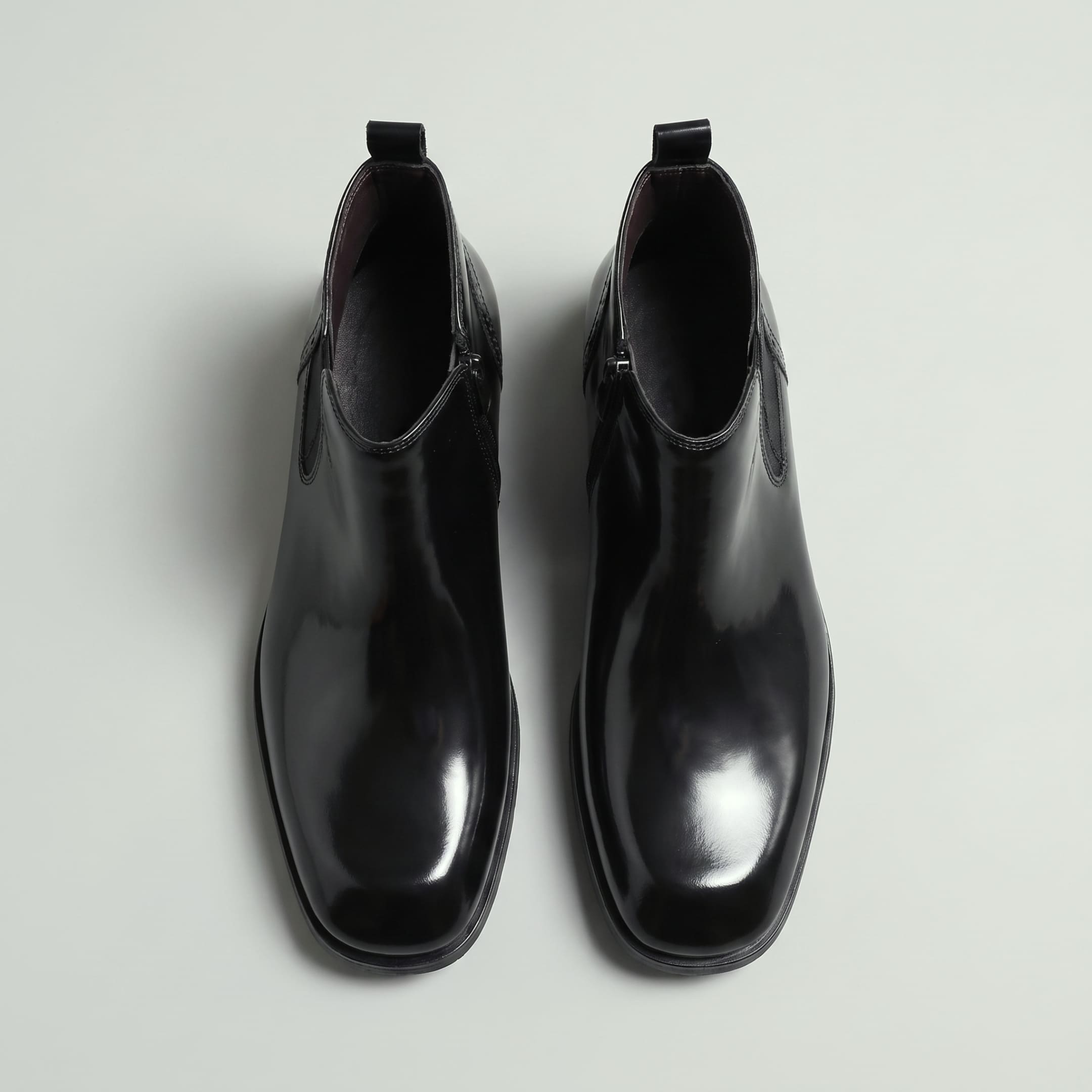 FORCIANO GARDA FOR MEN black elevator boots with genuine leather upper shown as a pair from above with pull tabs and ankle openings.