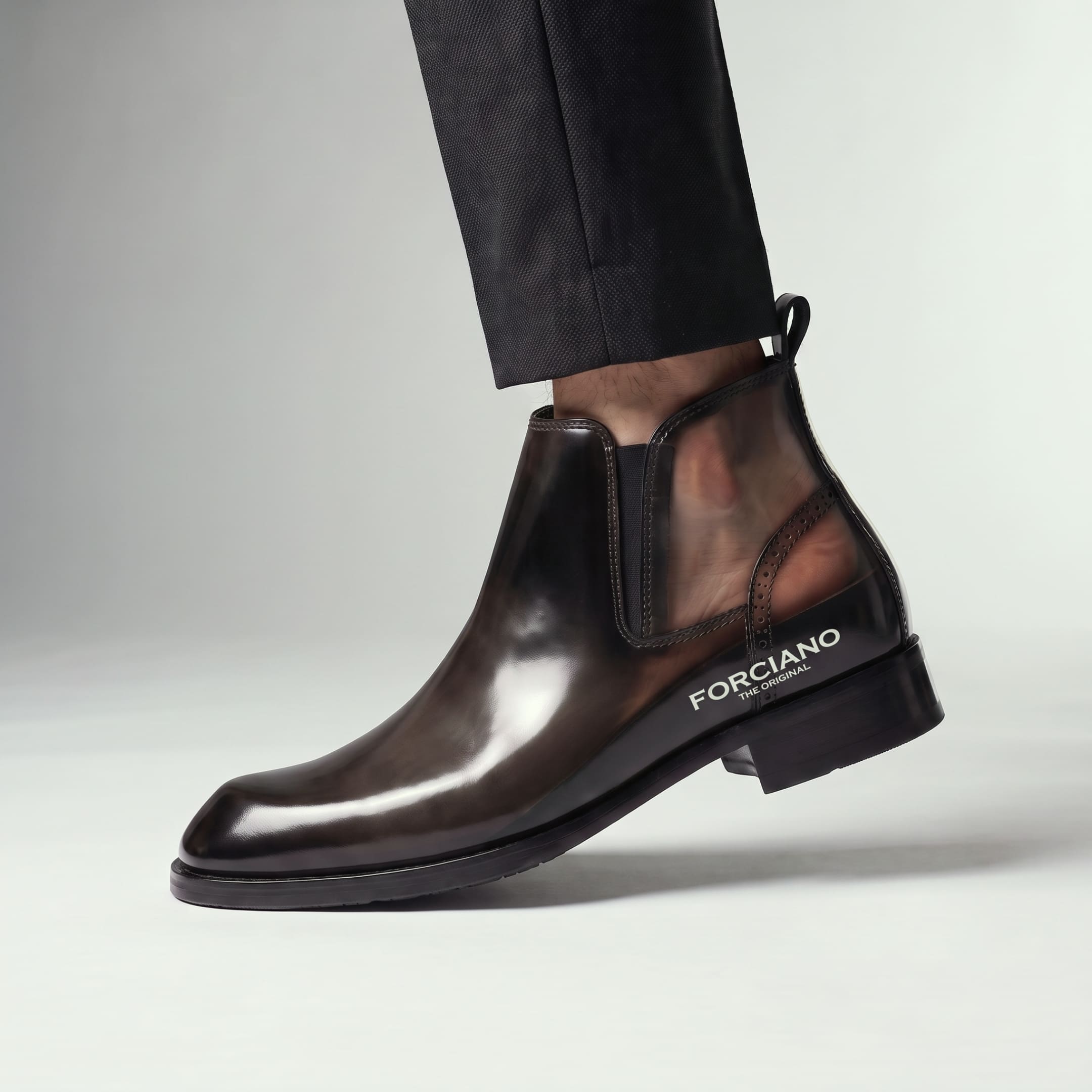 FORCIANO GARDA FOR MEN brown elevator boots shown worn in a side cutaway detail revealing the internal lift beneath the genuine leather upper.