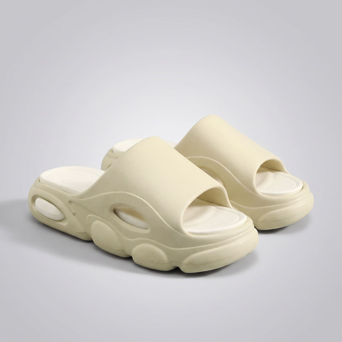 FORCIANO GLOW beige and white Height Increasing Slippers for Women shown as a pair from a front angle with ultra-soft EVA construction and open-toe design.