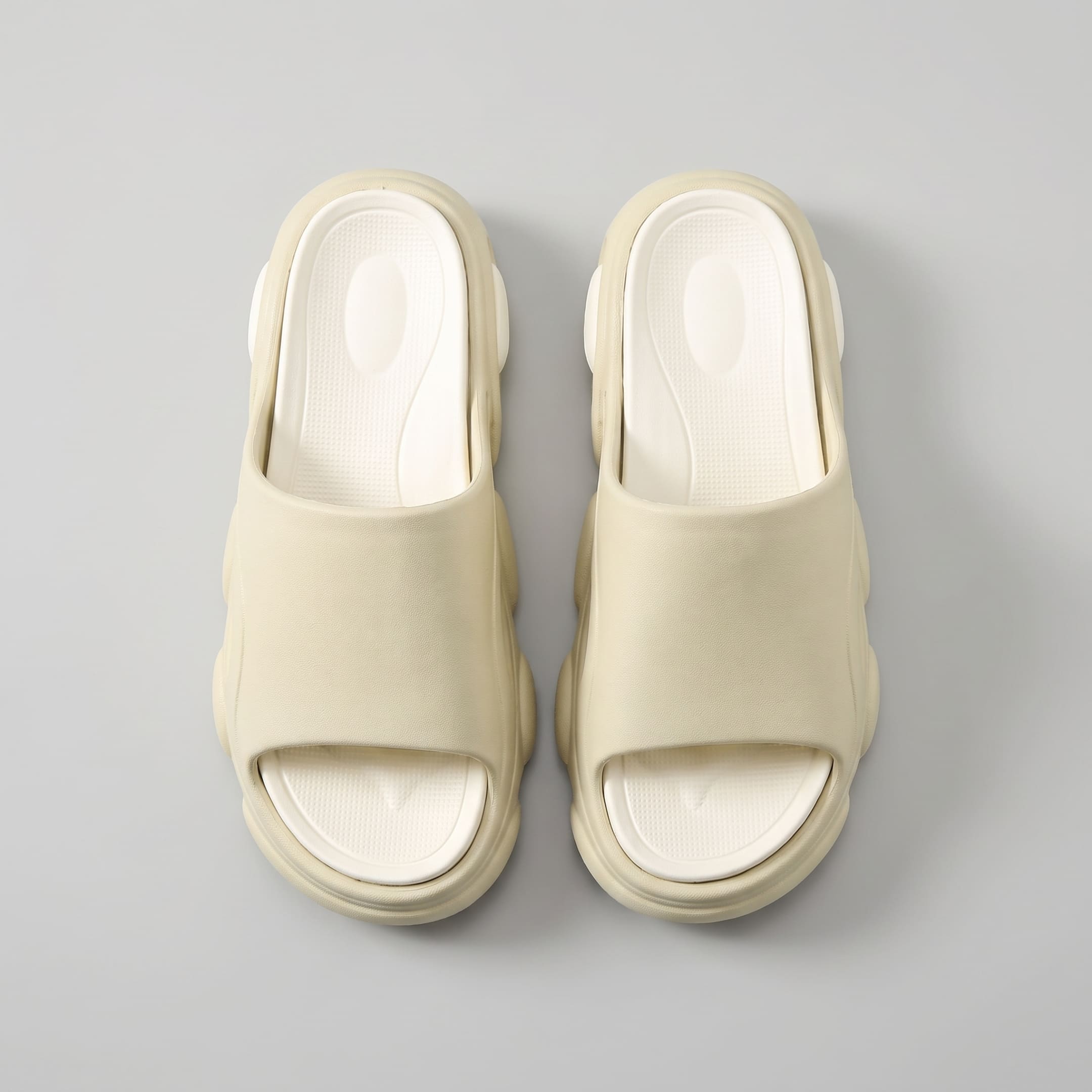 FORCIANO GLOW beige and white Height Increasing Slippers for Women shown as a pair from above with textured cushioned footbeds and wide straps visible.