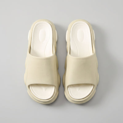 FORCIANO GLOW beige and white Height Increasing Slippers for Women shown as a pair from above with textured cushioned footbeds and wide straps visible.