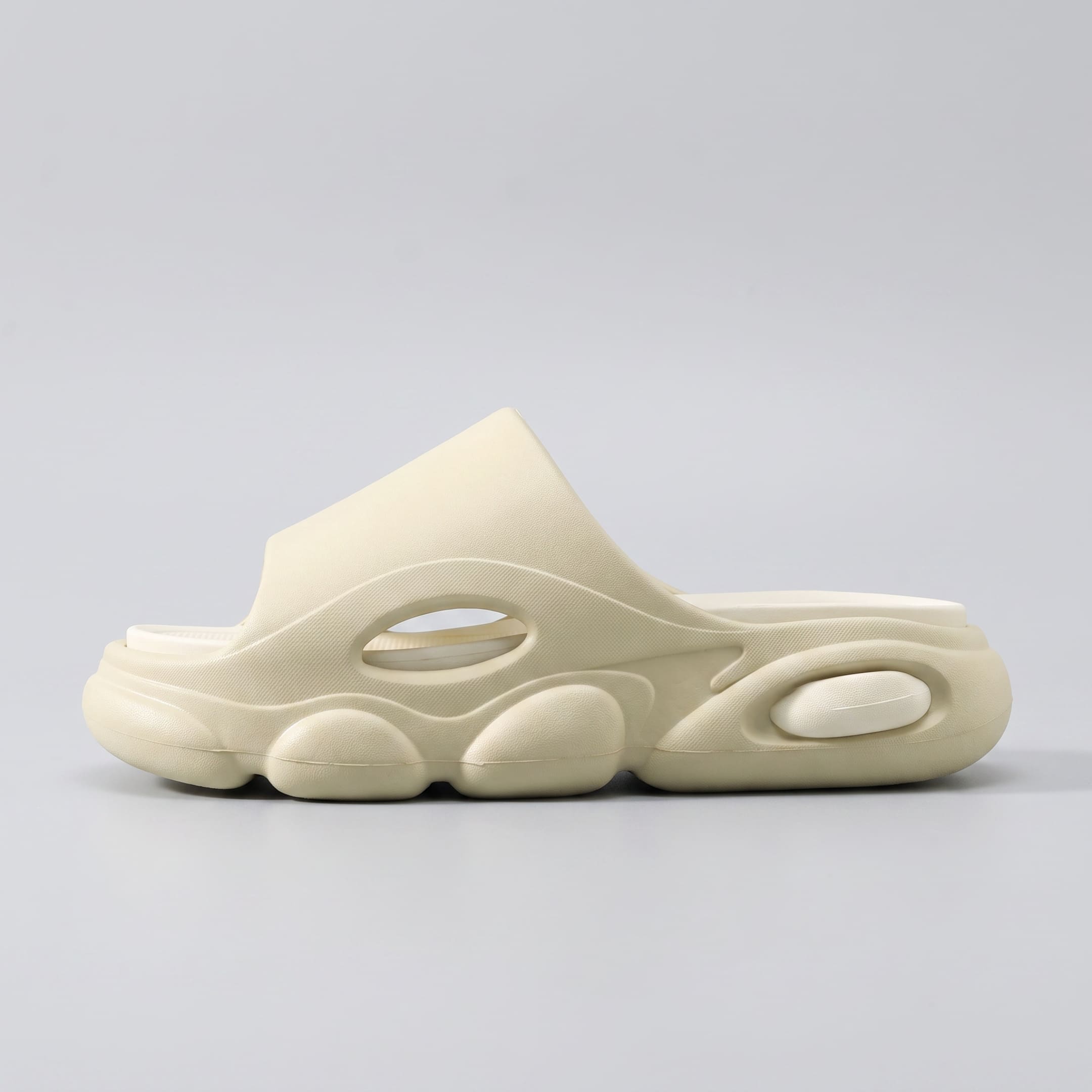 FORCIANO GLOW beige and white Height Increasing Slippers for Women shown in a clean side-profile view with sculpted ultra-soft EVA construction.