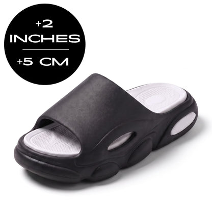 FORCIANO GLOW Height Increasing Slippers for Women in black and white with ultra-soft EVA construction, shown at a front angle with 5 cm / 2 inches height graphic.